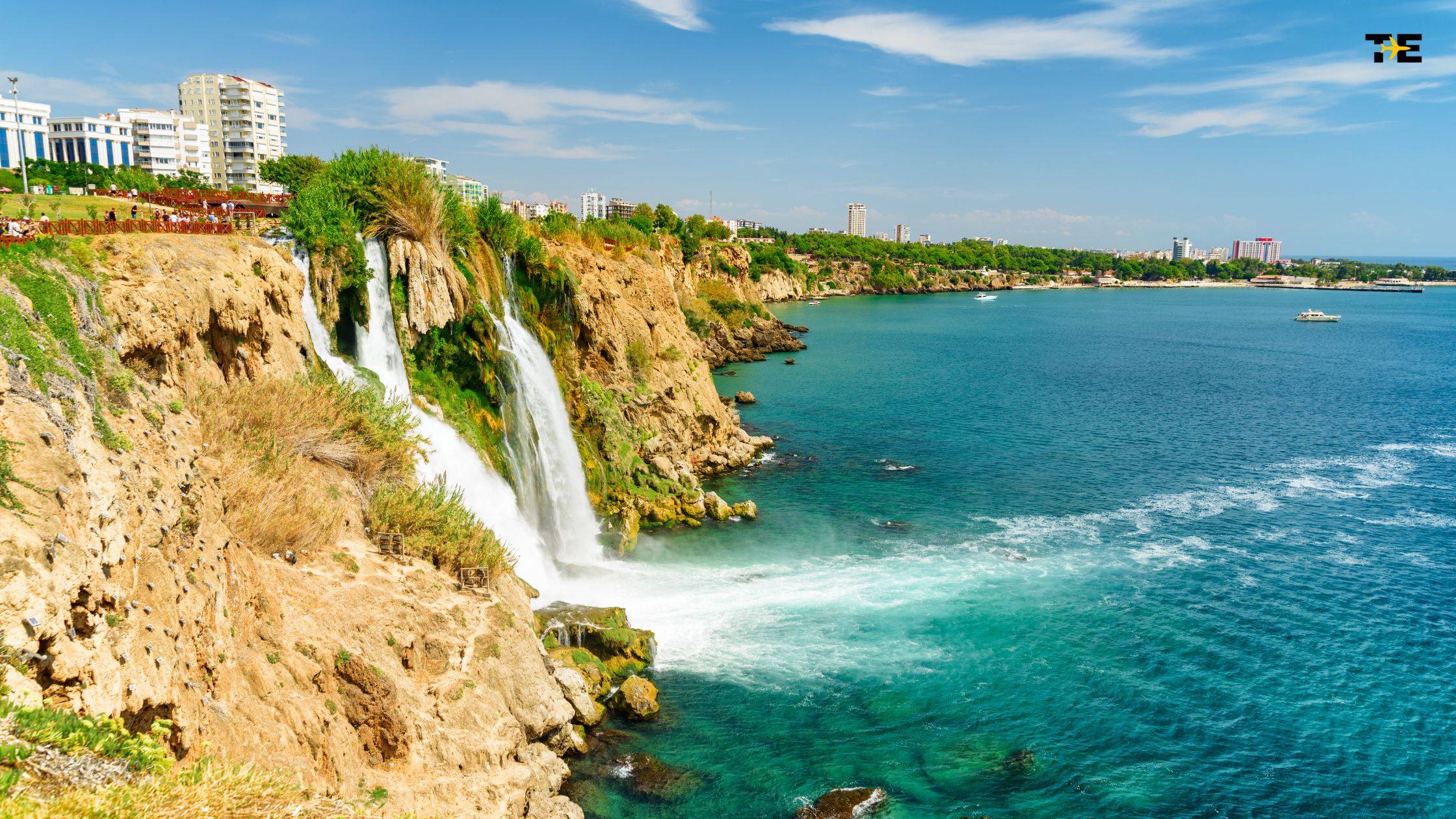 Duden Waterfalls cascades into turquoise waters, blending stunning nature with modern coastal living.