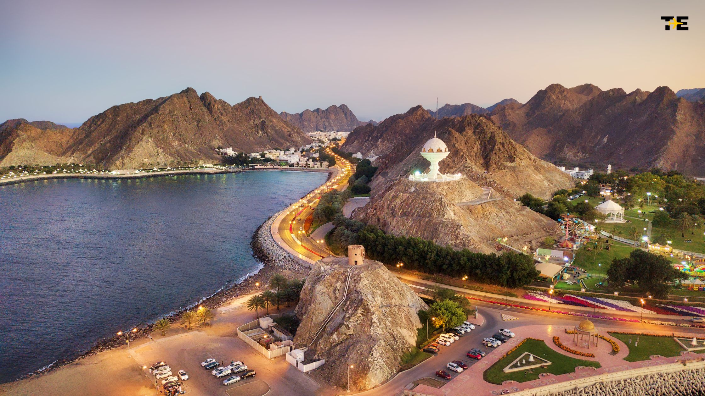 Panoramic view of Muscat, Oman, showcasing its stunning coastline, mountains, and vibrant architecture.