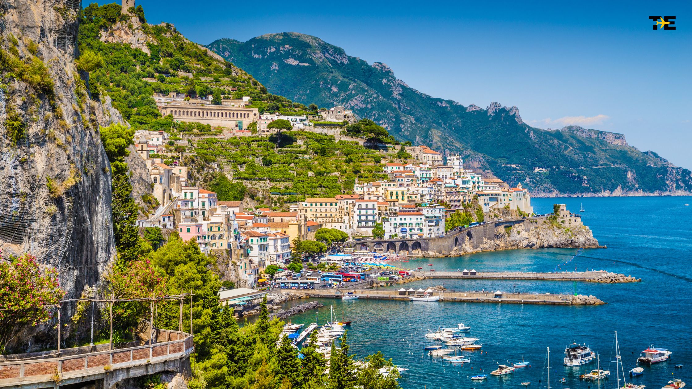 Vibrant coastal town along the Amalfi Coast with colorful buildings and a serene harbor.